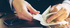 man counting money