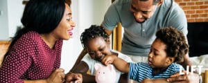 Family saving money piggy bank